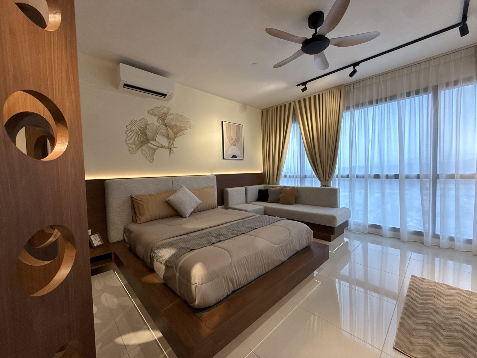 Edelweiss studio bedroom with full-height windows and curtains